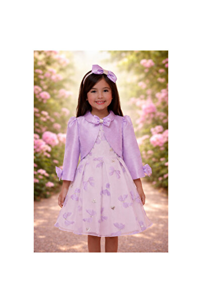 Pamina Purple dress with a bow, short jacket, and hair accessory