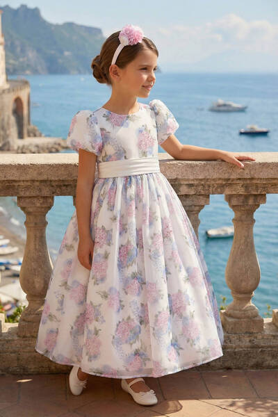 Pamina A floral organza maxi dress with a hair accessory