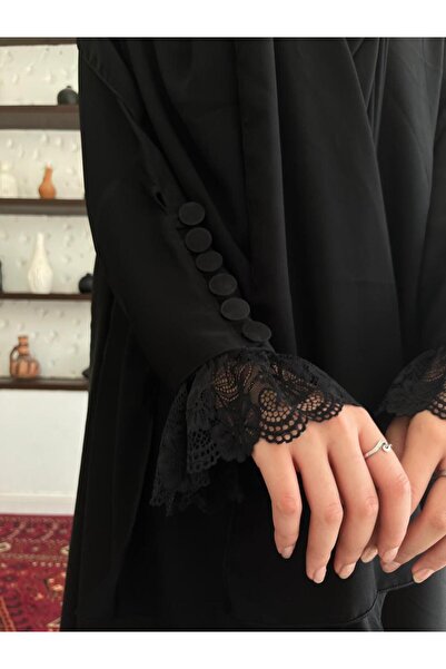 Elegant An abaya made of crepe fabric, decorated with lace on the sleeves and...