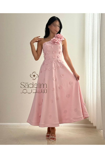 Sadeim A luxurious pink dress with floral details and an elegant, feminine de...
