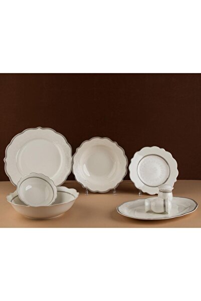 TOHFAT-AL MAIDAH A luxurious dinnerware set consisting of 28 pieces of fine p...