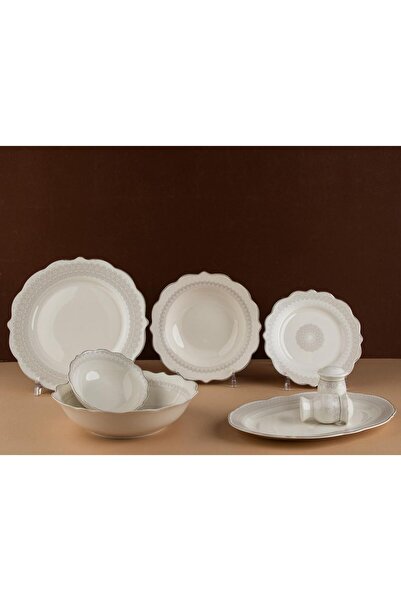 TOHFAT-AL MAIDAH A luxurious dinnerware set consisting of 28 pieces of fine p...