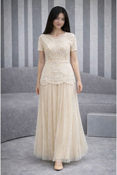 Joji A soft, flared dress with layers of sequins