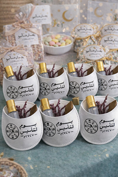 ceneric Foundation Day favors: Leather pockets with a piece of oud and white ...