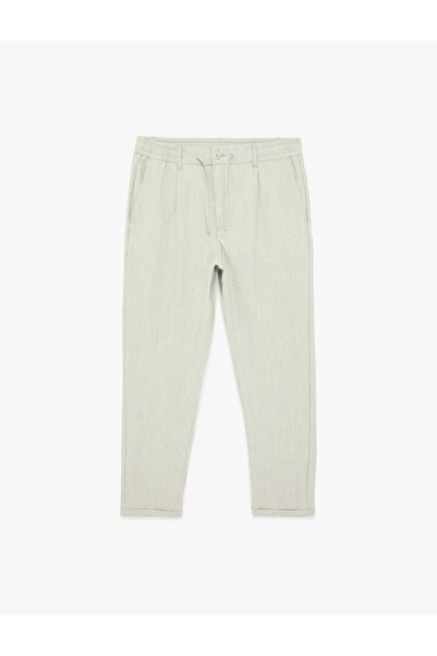 Koton Pantaloni cu buzunare duble la picior, talie elastică și nasturi