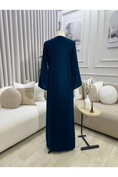 FASHION A long robe of navy velvet, embroidered with shiny beads in an attrac...