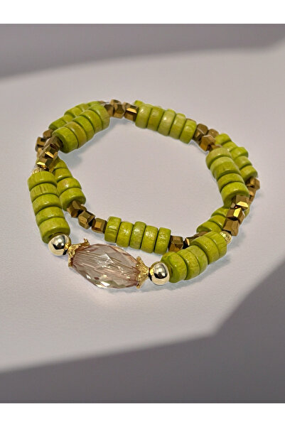 COCOSH TAKI Green wooden beaded bracelet with gold accents, designed for vers...