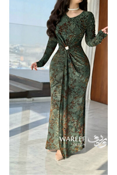 WAREEF FASHION A dark green dress with a warm floral pattern and elegant femi...