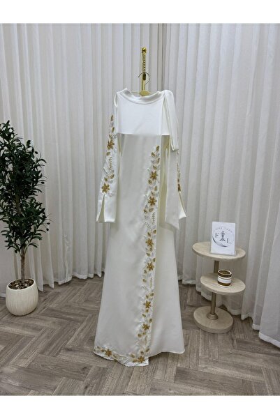 Farah Fashion This dress shines in a charming ivory white color, and features...