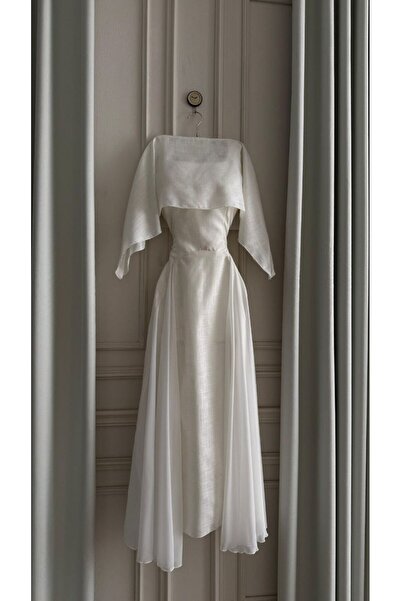 Special-DIARA A long, elegant white dress featuring a shoulder design