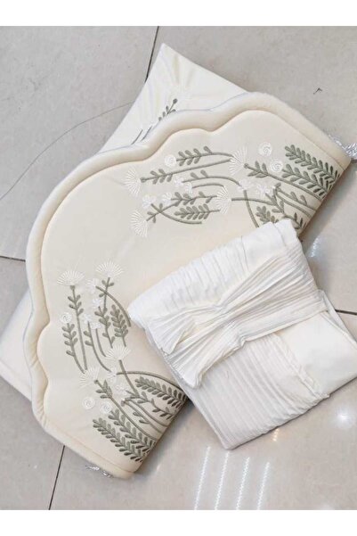 RUG A prayer set in pure white, featuring soft thread embroidery and a padded...