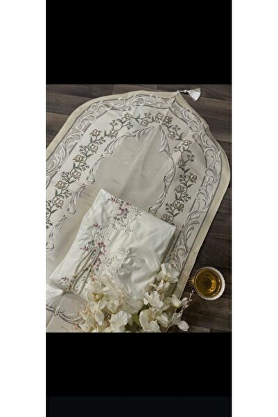 RUG A prayer set embroidered in pure white, adorned with calming colorful pat...