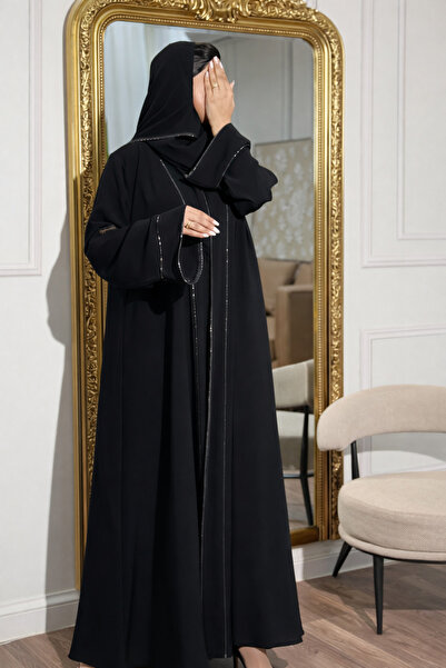 Elegant An elegant abaya made of crepe fabric, decorated with sparkling cryst...