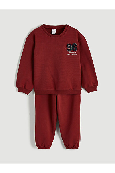 LC Waikiki مجموعة ميرال: سترة وبنطلون رياضي مطبوع باللون الأحمر الداكن للأولا...