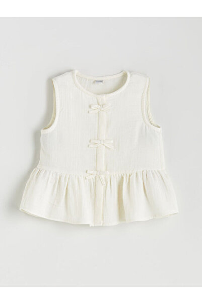 LC Waikiki بلوزة للفتيات بتفاصيل فيونكة على ياقة روبا من UZG STORE، تصميم جدي...