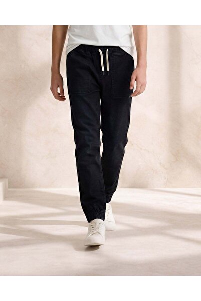 REDTAG بنطلون رياضي من الدنيم الأسود المحبوك للأولاد الكبار