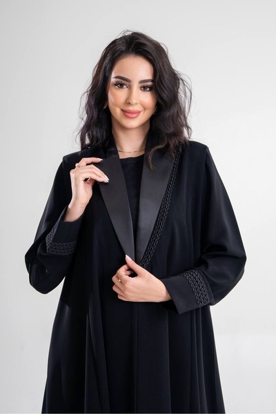 Al Afnan Boutique A distinctive, elegant abaya made of cobra Crepe fabric wit...