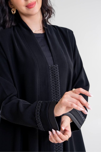 Al Afnan Boutique A luxurious abaya made of Cobra Crepe fabric with buttons d...