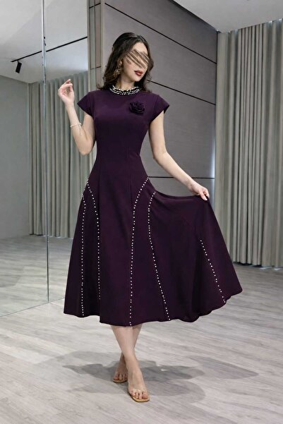 Jood A midi Eid dress with a pearl embellishment that exudes femininity