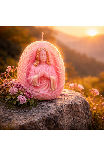 victiny Candle with the Image of Christ in the shape of an egg for Easter or ...