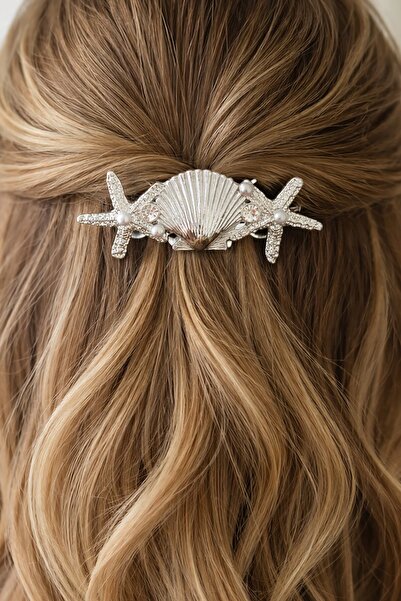 TAKIŞTIR Cataramă metalică automată de culoare argintie, cu figurine de scoic...