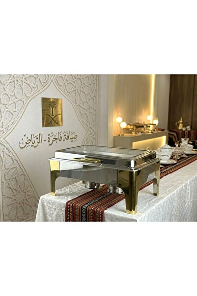 Afaq 9-liter hydraulic water heater, silver and gold combination.