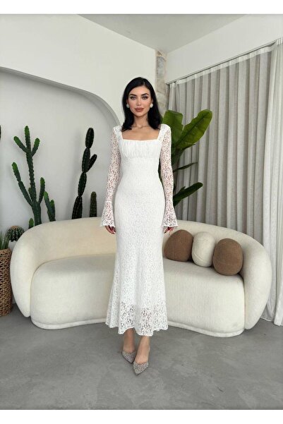 ETİKAFASHION A uniquely designed, modern dress with long sleeves and lace det...