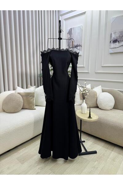 FASHION A black evening dress with a Drapey design and bare shoulders, decora...