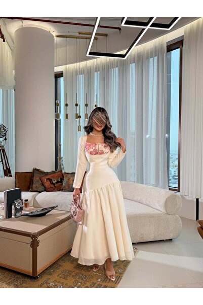 saher-alshrek A white dress with a unique cut