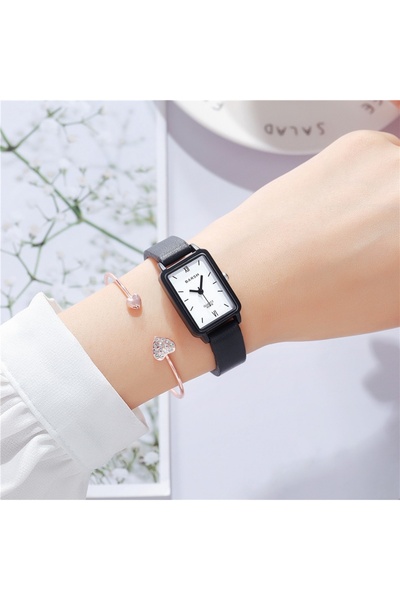 GENERAL A women's watch with a Leather strap and a rectangular dial, featurin...
