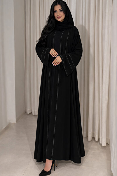 NND A crepe abaya adorned with sparkling crystal lines, delivered with a crys...