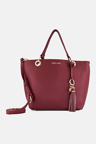 Anne Klein حقيبة تعليقة يد نسائية مزينة بشرابة معدنية، لون عنابي