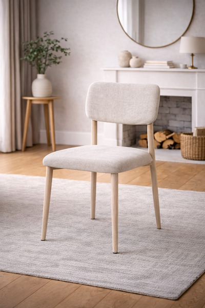 N.zone A modern dining chair Puffer in luxurious fabric with natural wood leg...