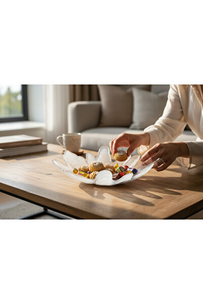 Generic A large, luxurious glass dish in an icy color and with a distinctive ...