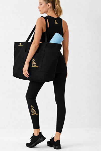 TWINTICKS طقم رياضي مكون من قطعتين - طقم ليجنز بتفاصيل ذهبية وقماش كانفاس حقي...