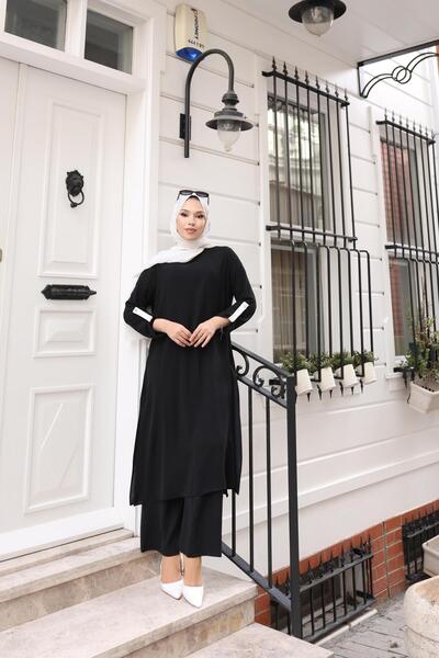 Kalemen Moda بدلة ايروبين بتفاصيل مميزة على الأكمام 1989 باللون الأسود