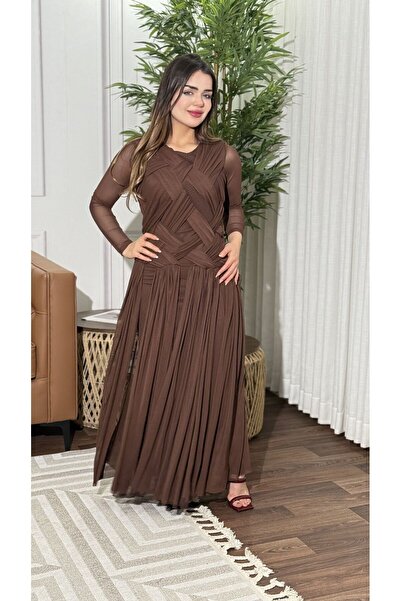 TREASUREISLAND An evening dress featuring a bodice with cross-draped fabric d...