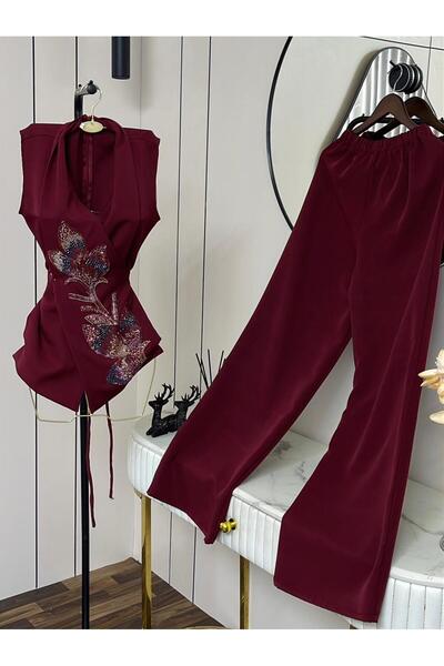 APARA Two-piece set consisting of an embroidered vest with a crossover collar...