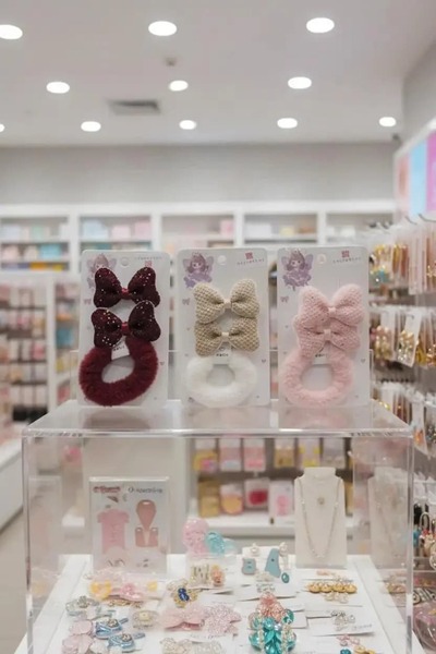 Miniso مشبك مطاطي بفيونكة وردية (قطعتان) - إكسسوار شعر أنيق وعصري