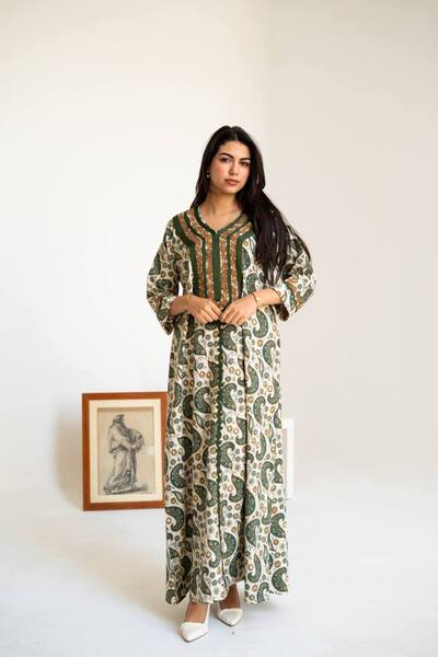 AFandina Linen jalabiya with a distinctive design and luxurious details, suit...