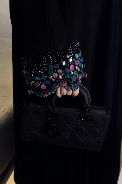 Karmen Elena's luxurious blue abaya with practical buttons and shimmering emb...