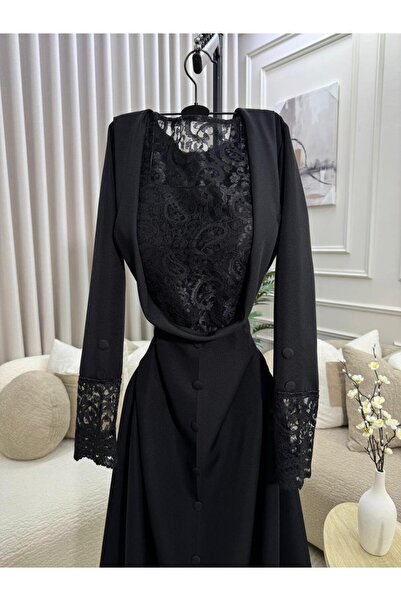 FASHION An elegant black dress decorated with lace on the chest and sleeves f...