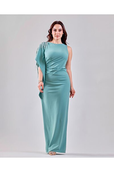 Opera Fashion A soft Crepe dress with a luxurious shoulder accessory.