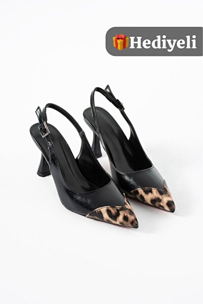 KM shoes imzasıyla, leoparın vahşi ruhu, siyahın zamansız şıklığıyla buluşuyo...