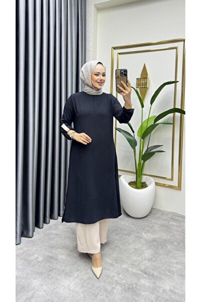 Kalemen Moda بدلة ايروبين بتفاصيل مزخرفة على الأكمام 1989 باللونين الأسود وال...