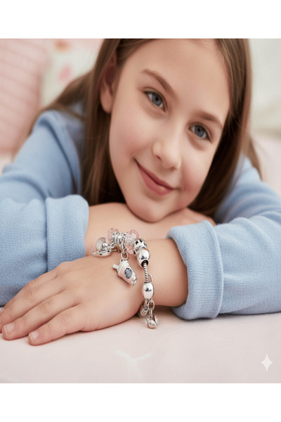 burjalmodah A stylish bracelet with playful charms and a modern design