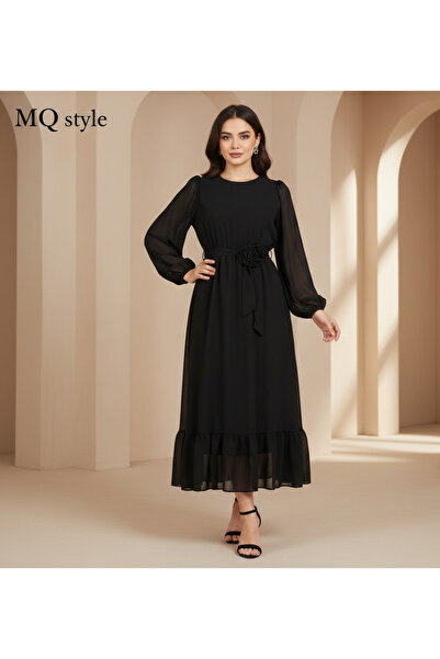 MQ A sophisticated black dress that combines classic elegance with modern tou...