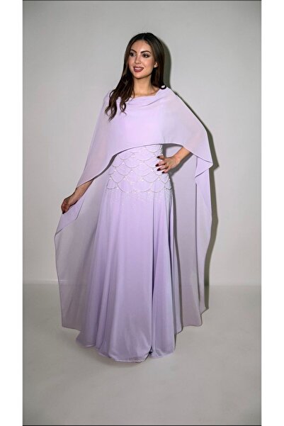 gmax A women's dress embroidered with pearls and beads.