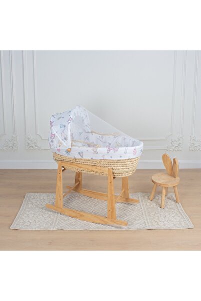 My Baby Moses basket made of straw with patterned fabric and a wooden front r...