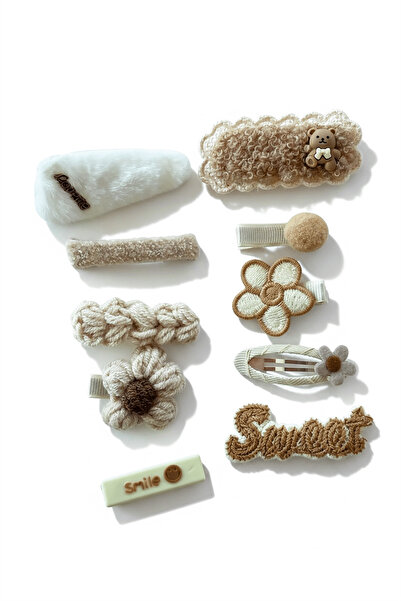 TAKIŞTIR Set od 10 bočnih kopči u krem boji sa mešovitim figurama